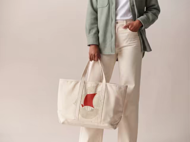 Canvas Tote Bag Mockup Held in a Studio