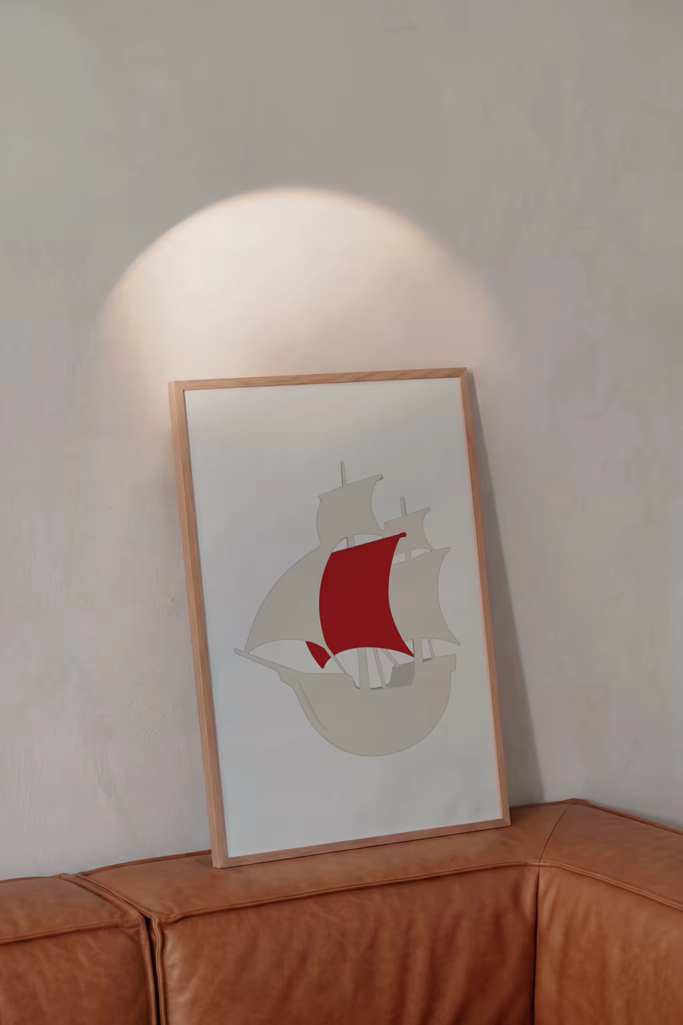 Slim Frame Poster Mockup Above a Leather Sofa