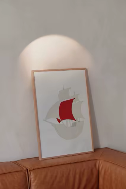 Slim Frame Poster Mockup Above a Leather Sofa