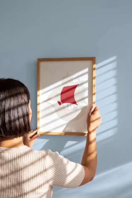 Wood Framed Print Mockup Hung on a Blue Wall
