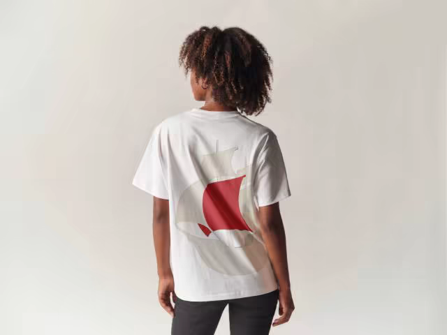 White Tee Mockup Worn in a Bright Studio