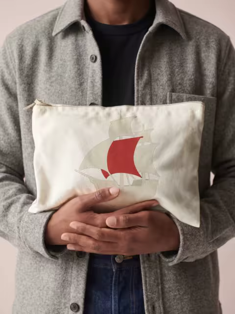 Zippered Canvas Pouch Mockup Held to the Chest