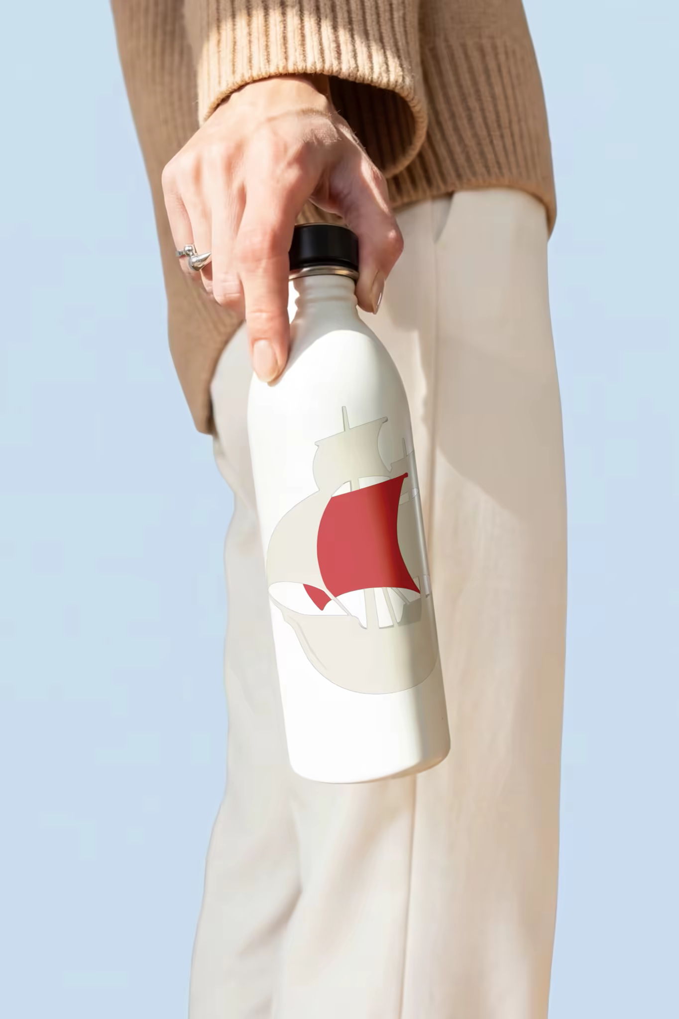 Water Bottle Mockup Carried Under a Blue Sky
