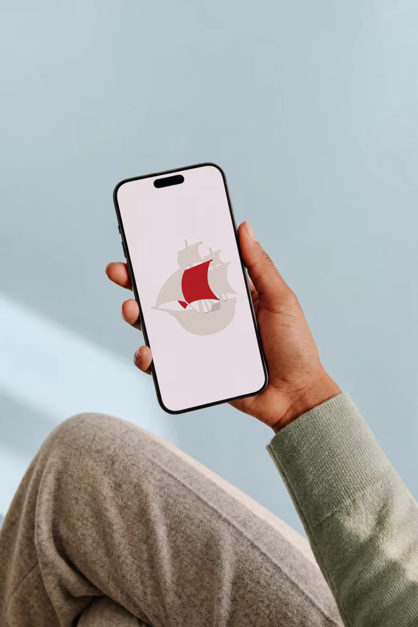 Phone in Hand Mockup With a Cozy Sweater