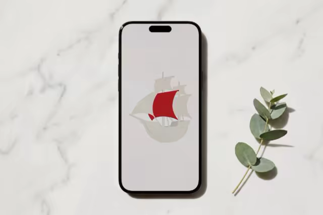 Phone Mockup on White Marble With Eucalyptus