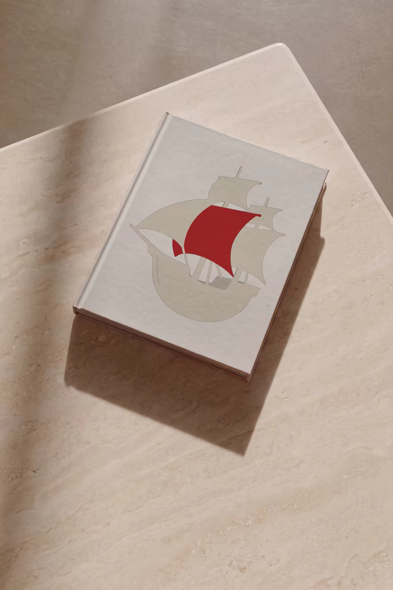 Hardcover Book Mockup on a Travertine Table