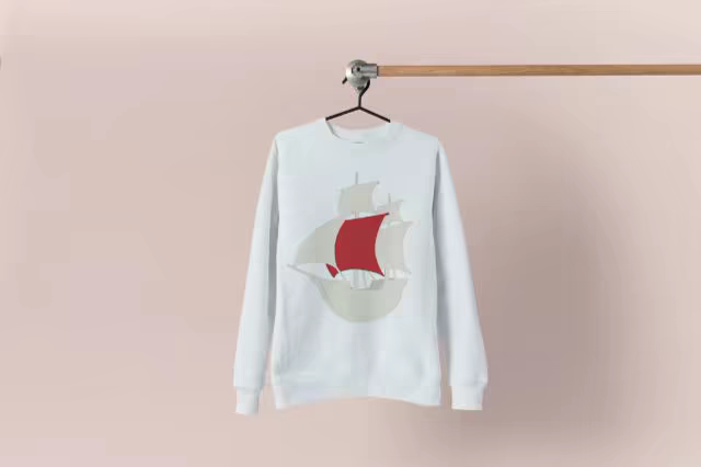 Sweatshirt Mockup Hanging Against Dusty Pink