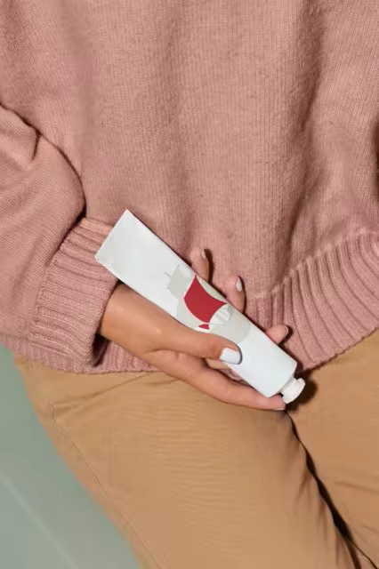 Cosmetic Tube Mockup in a Model's Hand
