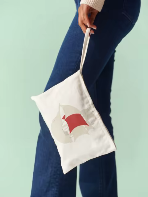 Canvas Pouch Mockup Dangling Beside Dark Denim