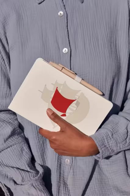 Notebook Mockup With Pen Held in Hand