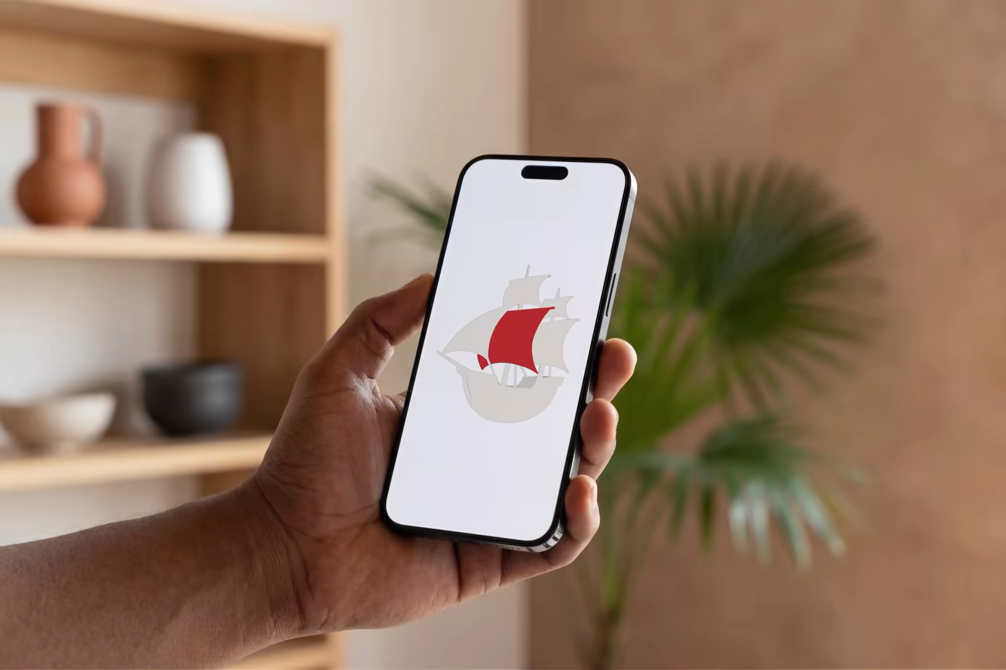 Phone Mockup in Hand by Wooden Shelves