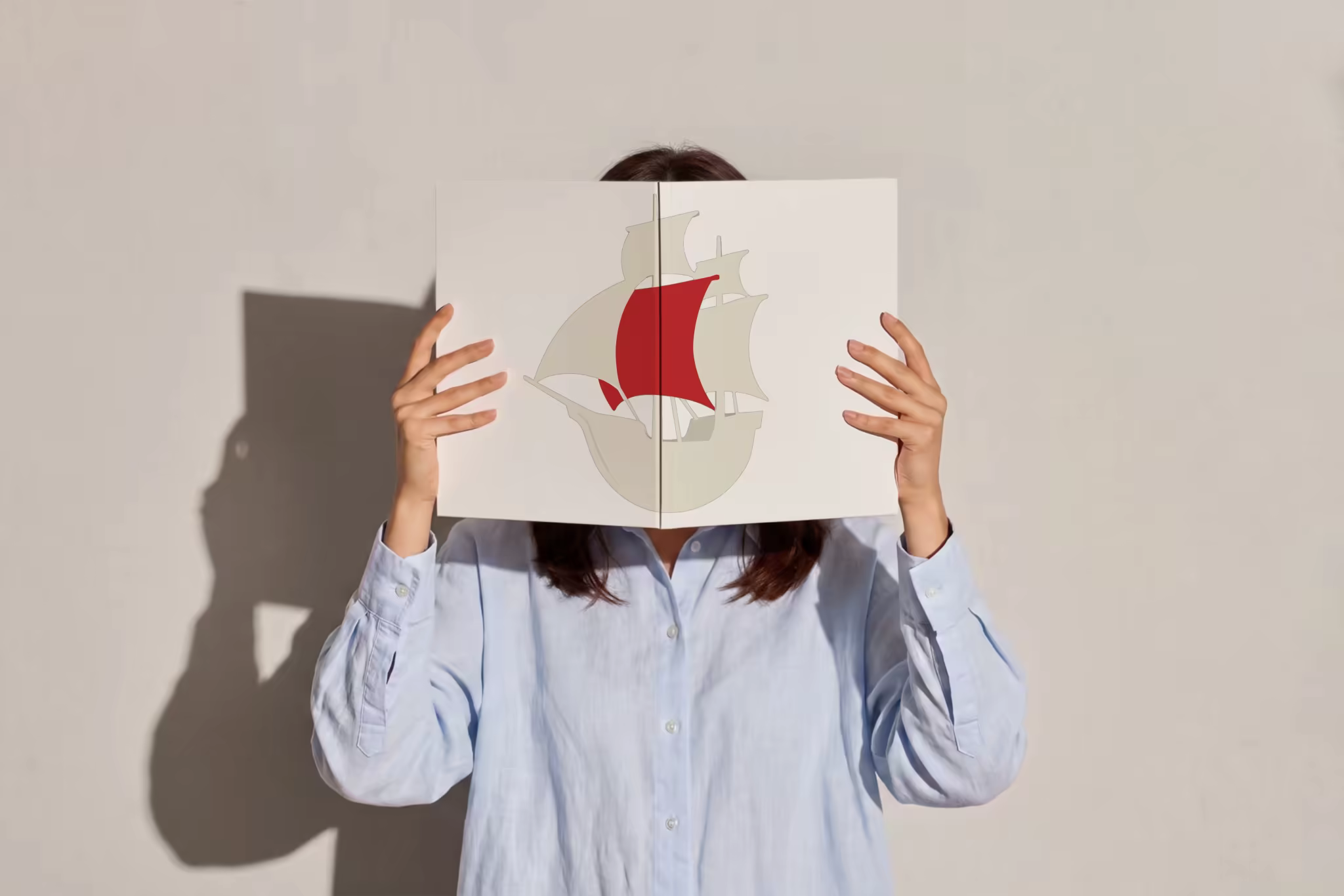 Open Book Mockup Held Up Before the Face