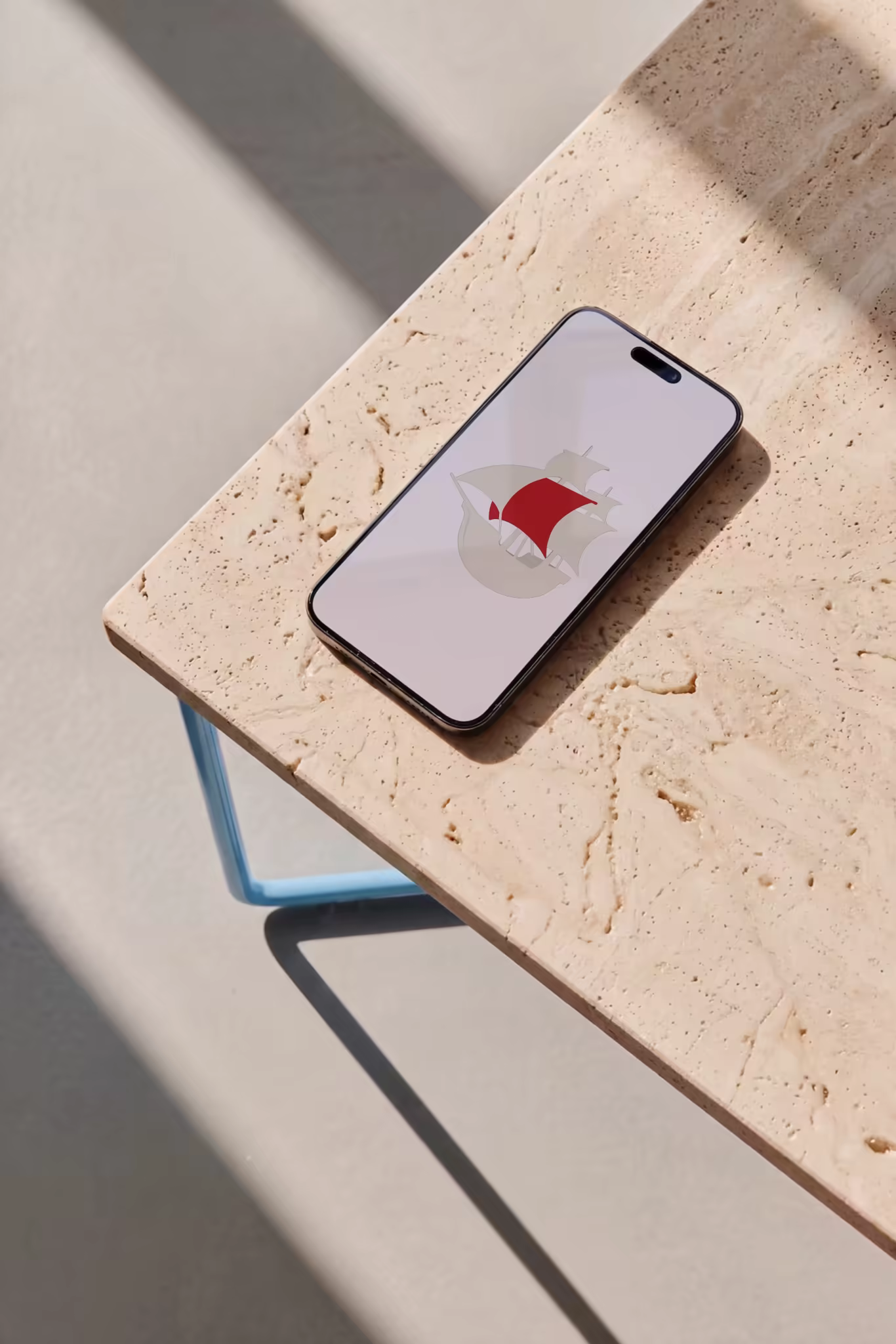 Phone Mockup on a Blue-Framed Stone Table