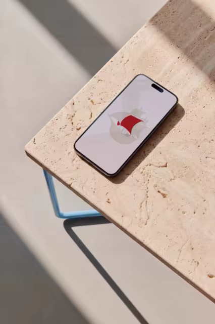 Phone Mockup on a Blue-Framed Stone Table