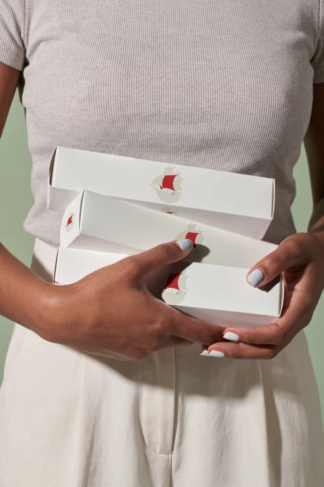 Cosmetic Box Mockup Trio Held in Hands