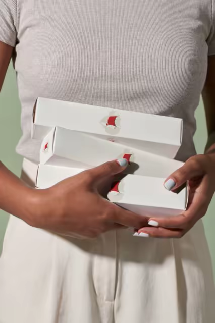 Cosmetic Box Mockup Trio Held in Hands