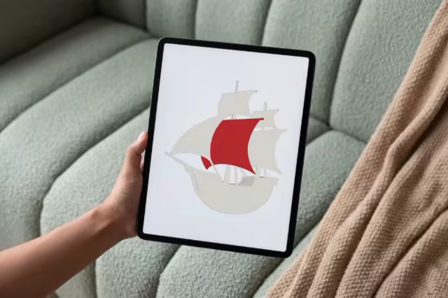 Tablet Mockup Held on a Sage Boucle Sofa