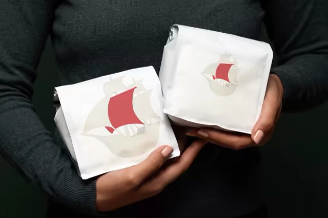 Coffee Bag Mockup Pair in Cupped Hands