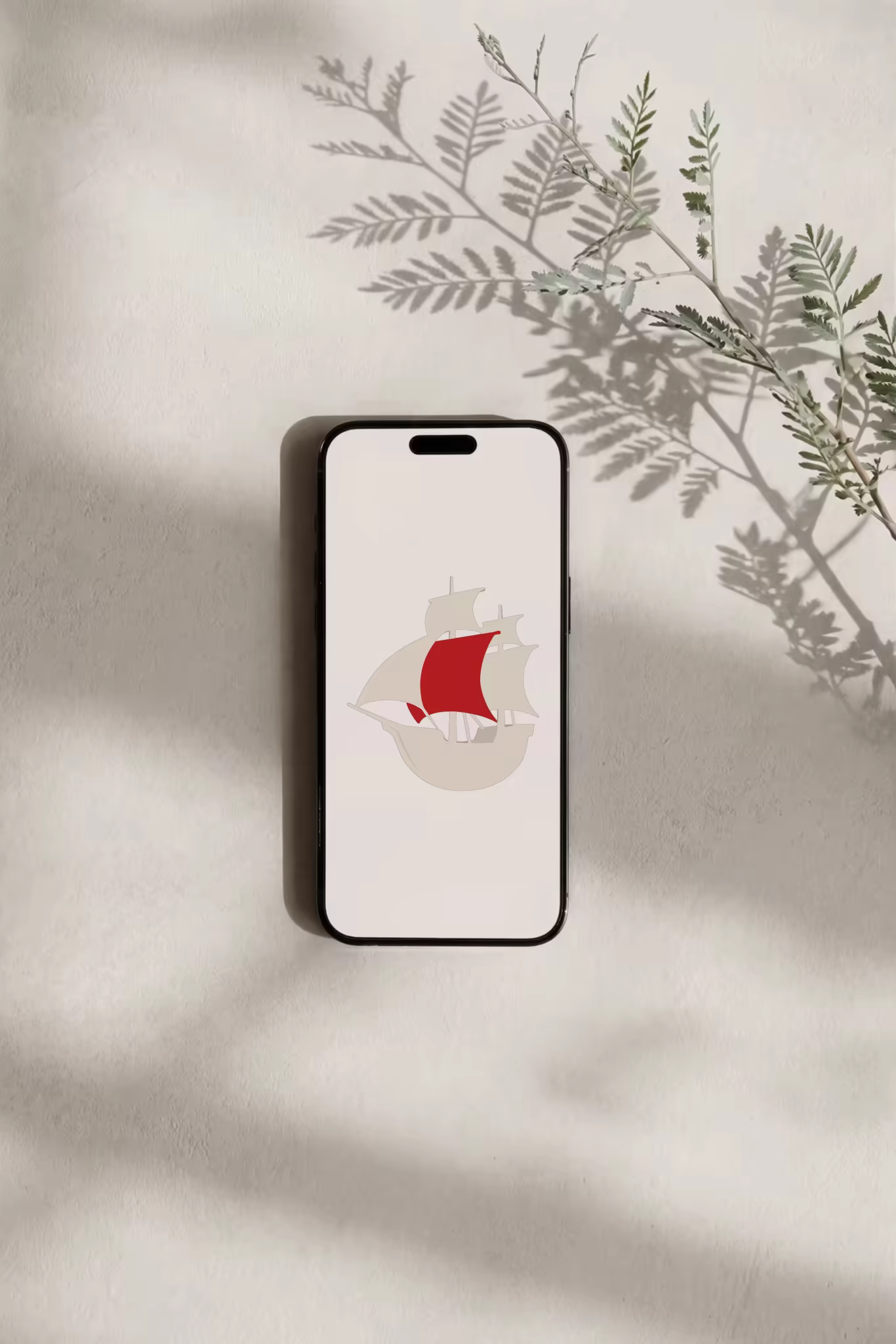 Phone Mockup on Plaster With Fern Shadows