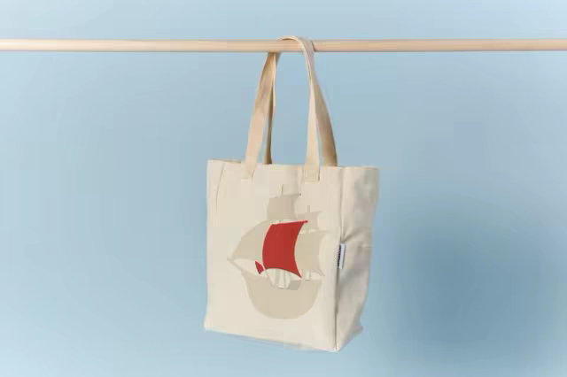 Canvas Tote Bag Mockup Hanging on a Wooden Rail