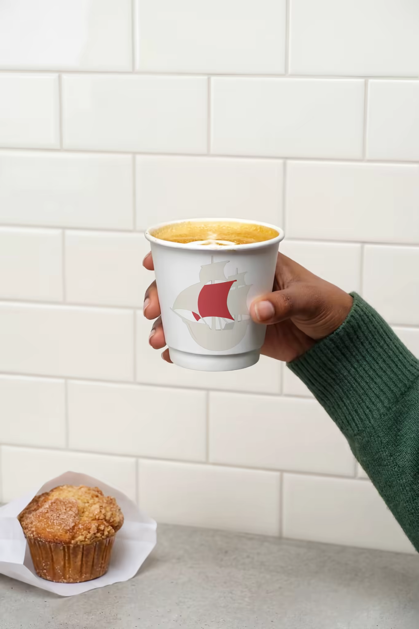 Paper Coffee Cup Mockup Held Against Subway Tile