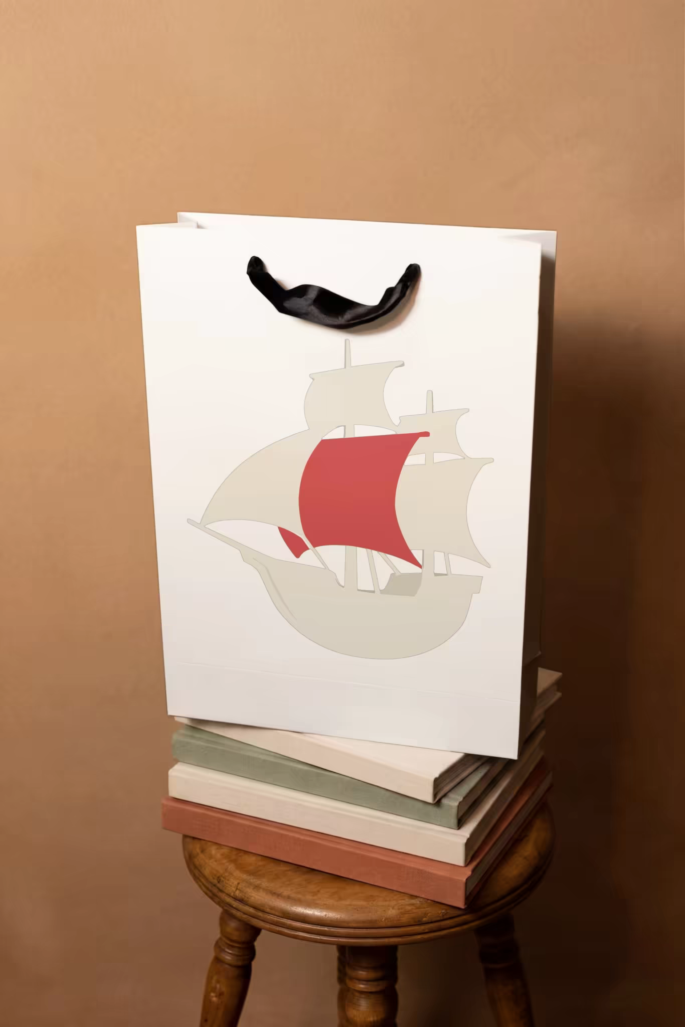 Paper Gift Bag Mockup on a Stack of Books