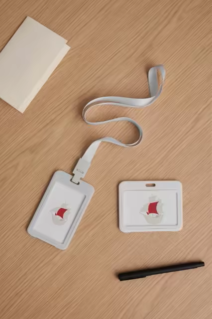 ID Badge Holder Mockup Set on an Oak Desk