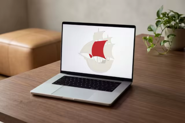 Silver Laptop Mockup on a Walnut Coffee Table