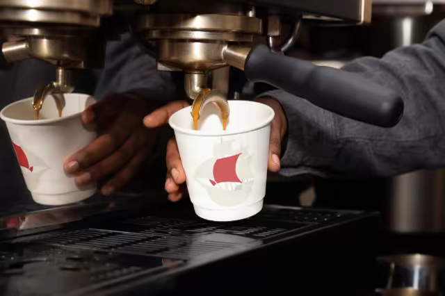 Paper Cup Mockup Under an Espresso Machine