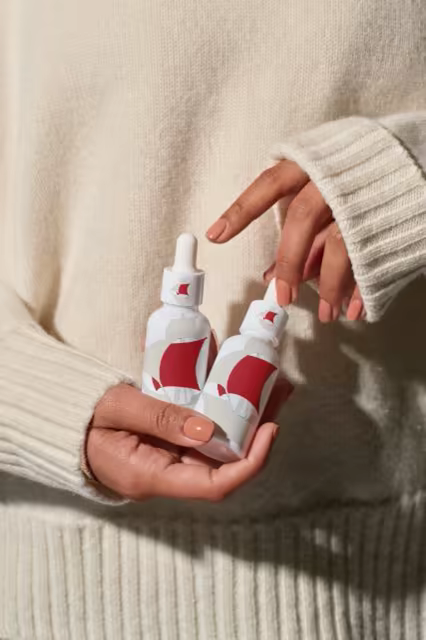 Serum Dropper Bottle Mockup Held in Hands