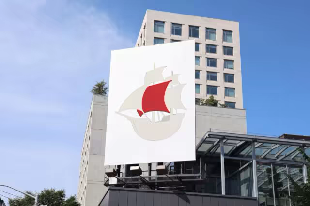 Building Banner Mockup Against a Clear Blue Sky