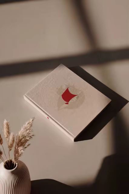 Hardcover Book Mockup Beside Dried Pampas Grass