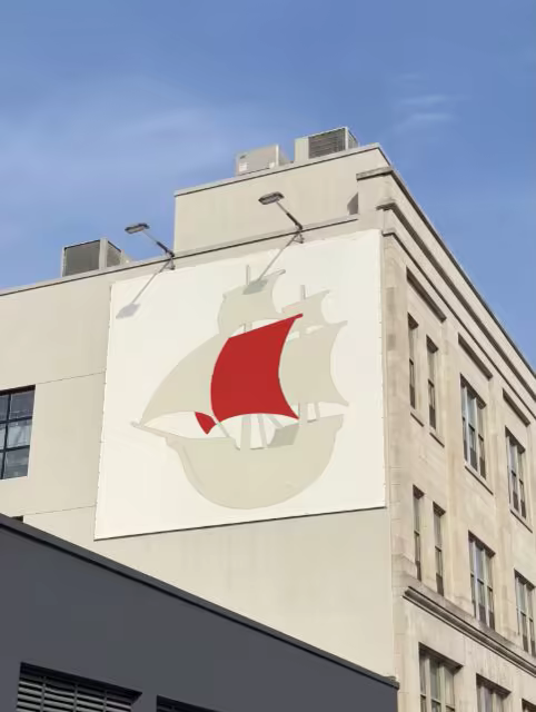 Wall Mounted Billboard Mockup on a Stone Building