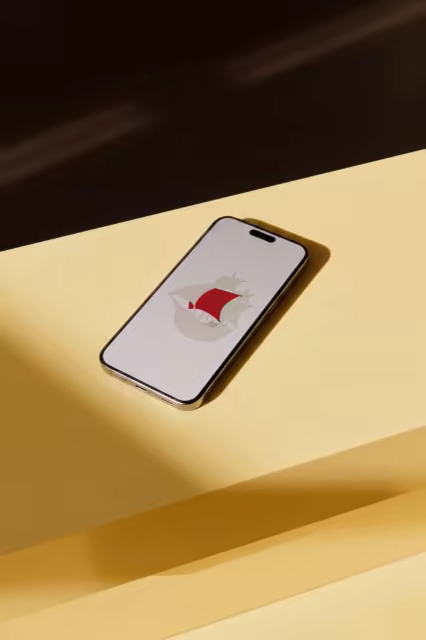 Smartphone Mockup on a Sunlit Yellow Ledge