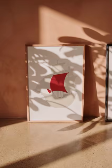 Framed Poster Mockup With Plant Shadows on Terracotta