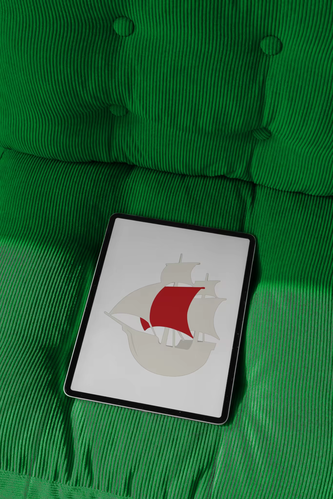 Tablet Mockup on a Green Corduroy Sofa