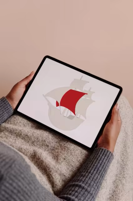 Tablet Mockup Held Over a Gray Knit Sweater