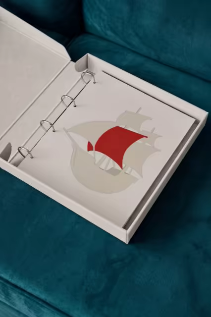 Ring Bound Album Mockup on a Teal Velvet Sofa
