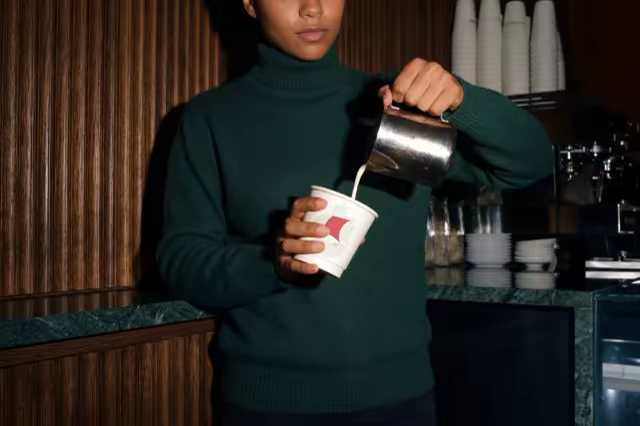 Paper Cup Mockup With a Milk Pour at a Cafe Bar