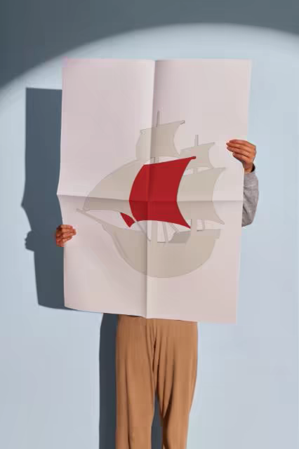 Folded Poster Mockup Held Up in a Spotlight