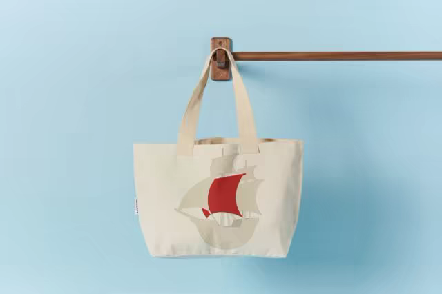 Canvas Tote Mockup Hung on a Wooden Wall Rail
