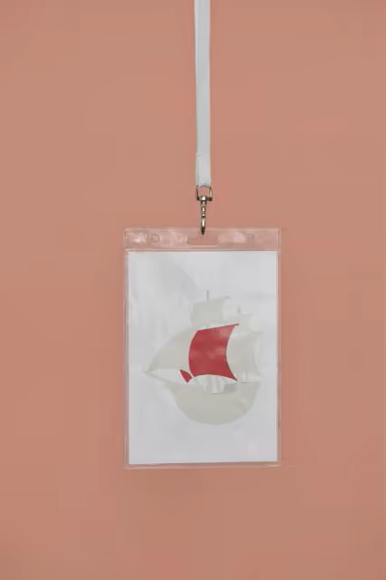 Badge Holder Mockup Hanging on a Salmon Wall