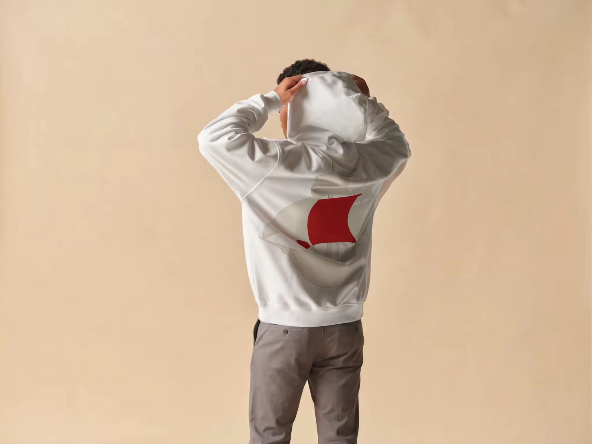 Gray Hoodie Mockup Worn in a Beige Studio
