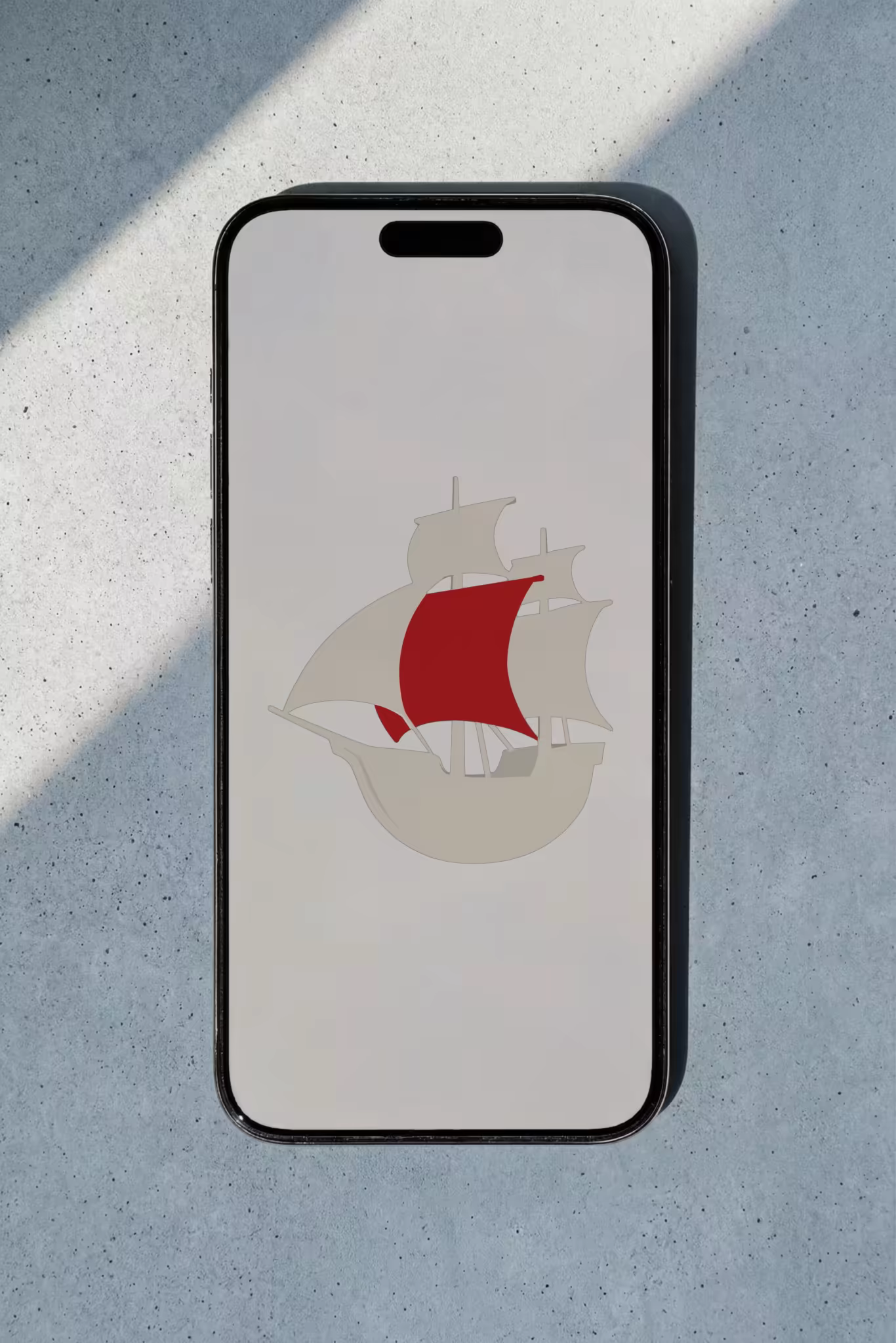 Phone Mockup on Sunlit Speckled Concrete