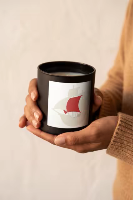 Black Candle Jar Mockup Held in Cupped Hands