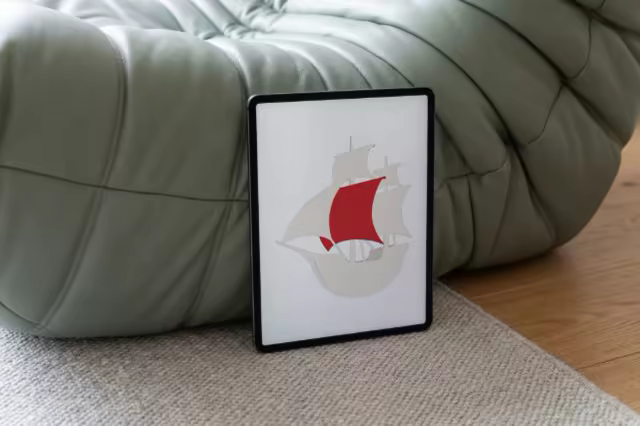 Tablet Mockup Against a Sage Leather Sofa
