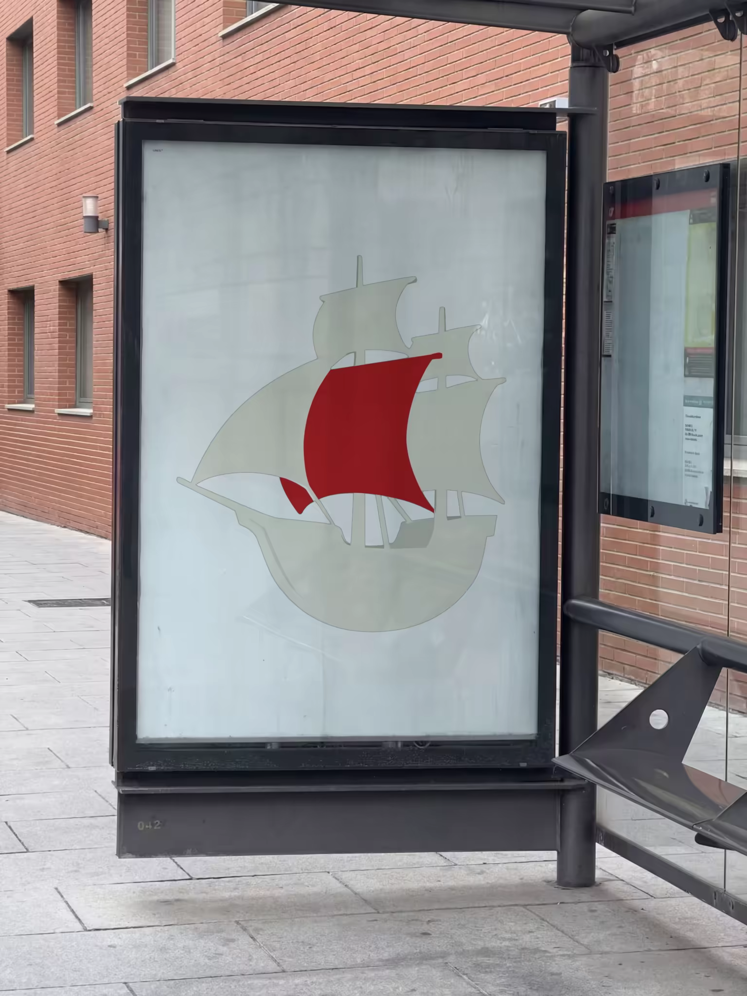 Bus Shelter Ad Panel Mockup on a Brick Street