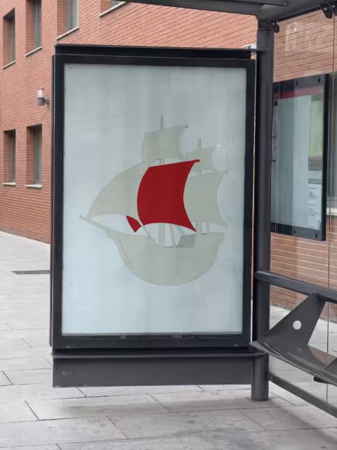Bus Shelter Ad Panel Mockup on a Brick Street
