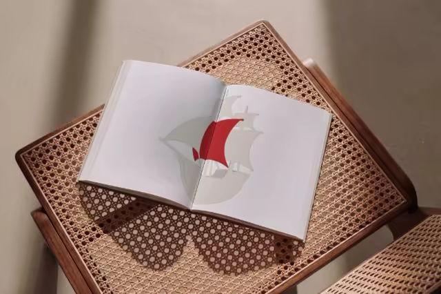 Open Book Mockup on a Woven Cane Table