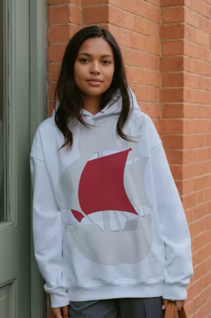 Oversized Hoodie Mockup by a Red Brick Wall